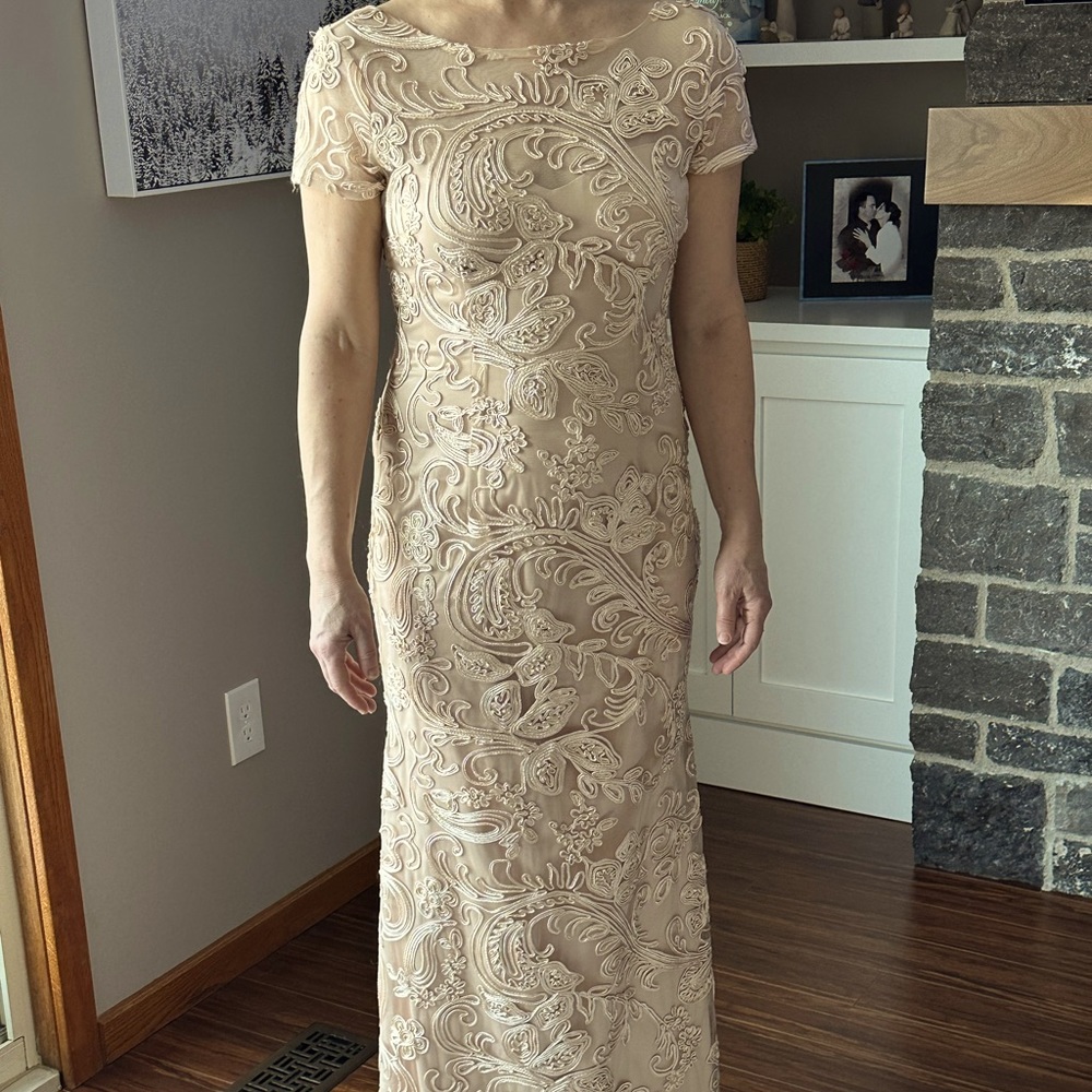 One of a kind formal gown imported from Spain. Ivory peach colour.